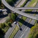 An HGV lorry is seen on its side after crashing through a barrier and falling from abridge on the M90 near Perth. Picture: Katielee Arrowsmith/SWNS