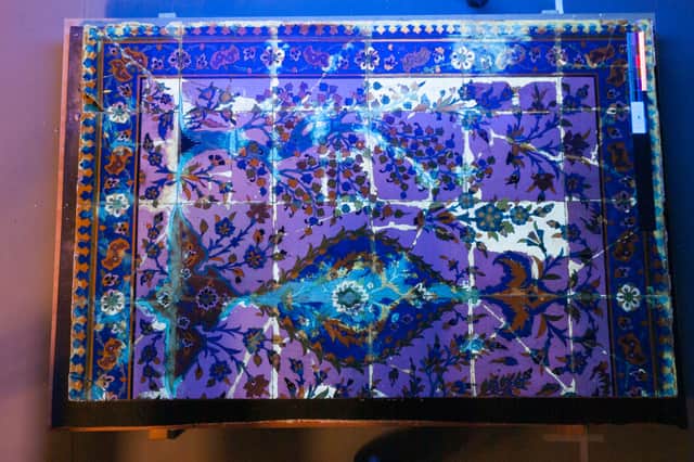 UV imaging demonstrates the extent of the overpainting.