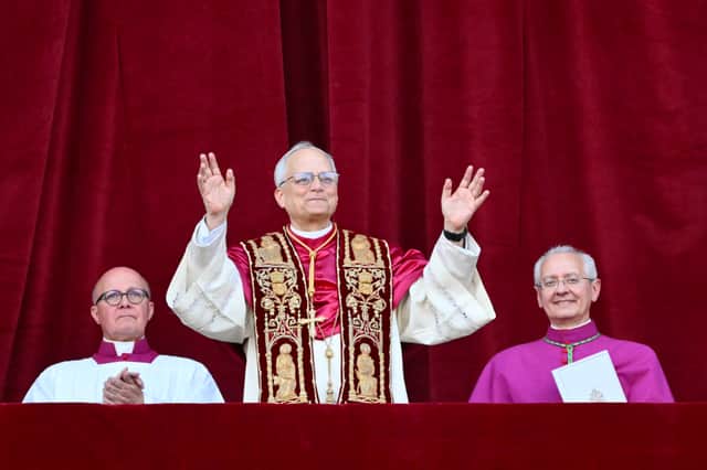 Newly elected Pope Leo XIV, Robert Prevost arrives on the main central loggia balcony of the St Peter's Basilica for the first time, after the cardinals ended the conclave