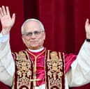 Newly elected Pope Leo XIV, Robert Prevost arrives on the main central loggia balcony of the St Peter's Basilica for the first time, after the cardinals ended the conclave, in The Vatican