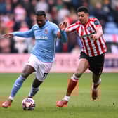 Haji Wright of Coventry City holds off the challenge of Jobe Bellingham of Sunderland during the Sky Bet Championship match at The CBS Arena. Cr: Getty Images.