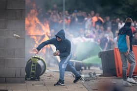 Rioters attack a Holiday Inn Express Hotel where asylum seekers were staying In Rotherham in August last year (Picture: Christopher Furlong)