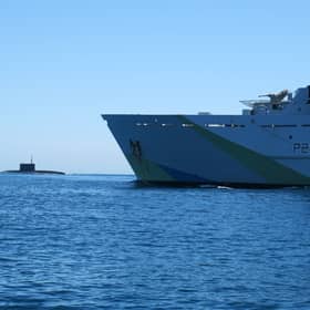 A “secret weapon” is being developed and could be used by Royal Navy technicians to search for Russian submarines. Pictured: HMS Tyne with Russian Kilo-class submarine Krasnodar in the background.