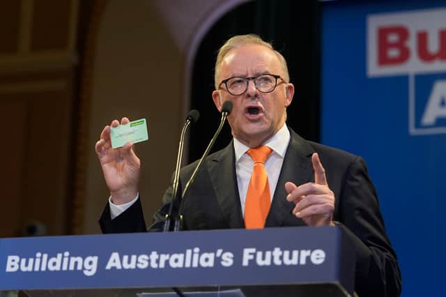 Labor party leader Anthony Albanese, seen holding up his Medicare card, was successful because of a focus on issues that matter to people's lives, like healthcare (Picture: Asanka Ratnayake)
