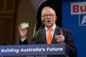 Labor party leader Anthony Albanese, seen holding up his Medicare card, was successful because of a focus on issues that matter to people's lives, like healthcare (Picture: Asanka Ratnayake)