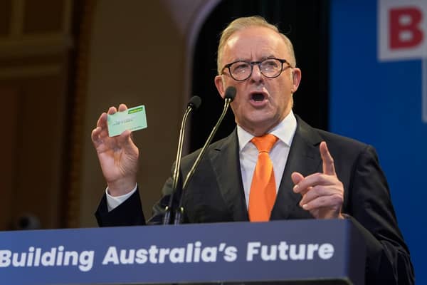 Labor party leader Anthony Albanese, seen holding up his Medicare card, was successful because of a focus on issues that matter to people's lives, like healthcare (Picture: Asanka Ratnayake)
