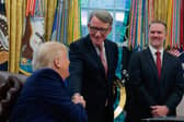 Donald Trump shakes hands with Peter Mandelson, the UK's ambassador to the US, during the announcement of a new trade deal between the two countries (Picture: Anna Moneymaker)