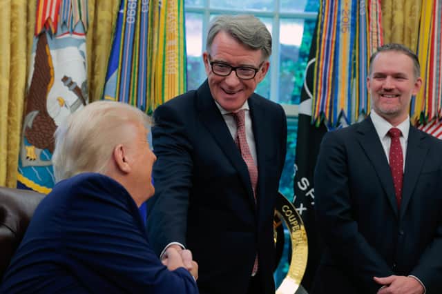 Donald Trump shakes hands with Peter Mandelson, the UK's ambassador to the US, during the announcement of a new trade deal between the two countries (Picture: Anna Moneymaker)