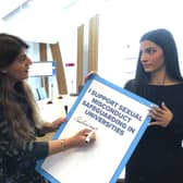 Pam Gosal MSP, left, signs a petition raised by rape survivor and campaigner Ellie Wilson calling for national safeguarding guidance in universities (Picture: Neil Pooran)