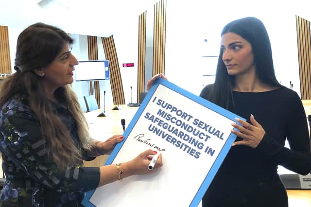 Pam Gosal MSP, left, signs a petition raised by rape survivor and campaigner Ellie Wilson calling for national safeguarding guidance in universities (Picture: Neil Pooran)