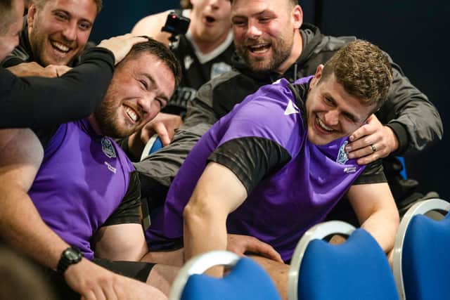 Celebrations in the Glasgow Warriors team room as Zander Fagerson, left, and Scott Cummings find out they're in the Lions squad.