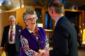Restaurateur, broadcaster and cookery writer Prue Leith shakes hands with Liam McArthur MSP as she lends her support to his bill to legalise assisted dying in Scotland (Picture: Jeff J Mitchell)