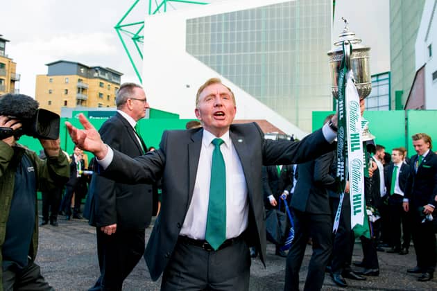 Hibs owner Sir Tom Farmer holds the Scottish Cup outside Easter Road following the 2016 final.