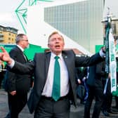 Hibs owner Sir Tom Farmer holds the Scottish Cup outside Easter Road following the 2016 final.