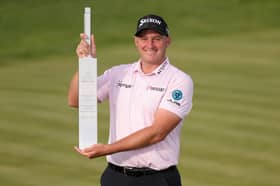 Sepp Straka poses with the trophy after winning the Truist Championship at The Wissahickon at Philadelphia Cricket Club in Pennsylvania