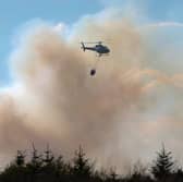 Helicopter used during a wildfire to douse flames 