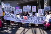 Protesters demonstrate against the Assisted Dying Bill outside the Scottish Parliament (Picture: Andrew Milligan)