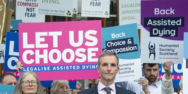 Liberal Democrat MSP Liam McArthur speaks tio suppoters ahead of the vote on assisted dying at Holyrood