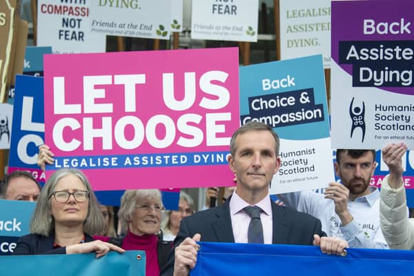 Liberal Democrat MSP Liam McArthur speaks tio suppoters ahead of the vote on assisted dying at Holyrood