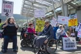 Protesters outside the Scottish Parliament ahead of the vote