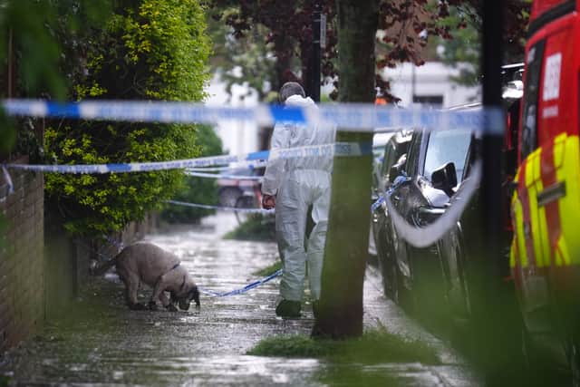 A forensics officer with a dog is seen in Kentish Town, north London. Police are investigating a fire at Sir Keir Starmer's house in north London. Picture: James Manning/PA Wire