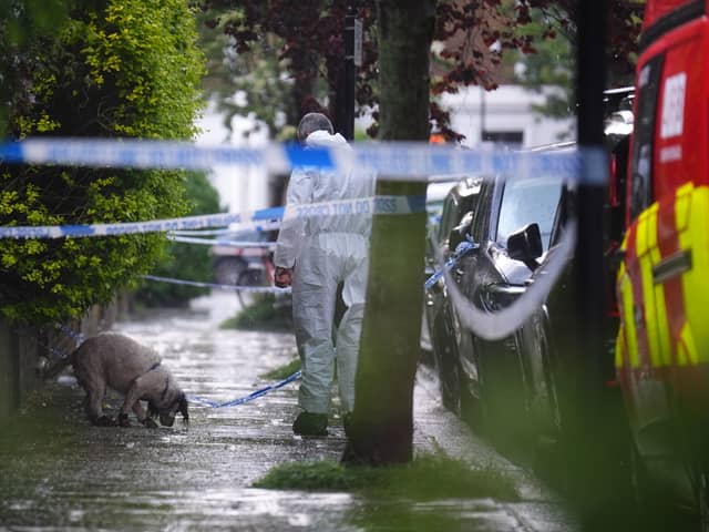 A forensics officer with a dog is seen in Kentish Town, north London. Police are investigating a fire at Sir Keir Starmer's house in north London. Picture: James Manning/PA Wire