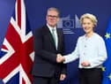 Keir Starmer, seen shaking hands with European Commission president Ursula von der Leyen, is seeking to remove barriers to trade with the European Union but there will be no return to the customs union (Picture: Benjamin Cremel/pool)