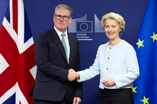 Keir Starmer, seen shaking hands with European Commission president Ursula von der Leyen, is seeking to remove barriers to trade with the European Union but there will be no return to the customs union (Picture: Benjamin Cremel/pool)
