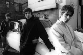 Oasis pictured in Withington, Manchester, November 1993, from l-r: Paul McGuigan, Noel Gallagher, Tony McCarroll, Paul Arthurs, Liam Gallagher