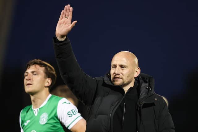 Hibs head coach David Gray salutes the fans after clinching third place.