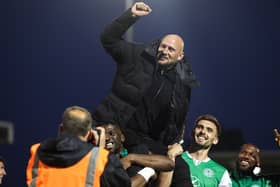 David Gray takes the acclaim of the Hibs support after finishing third.