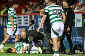 Celtic's Reo hatate goes down with an injury during the 5-1 win over Aberdeen at Pittodrie. (Photo by Paul Devlin / SNS Group)