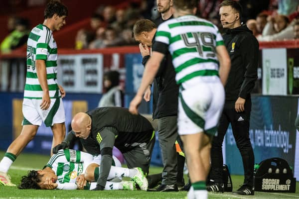 Celtic's Reo hatate goes down with an injury during the 5-1 win over Aberdeen at Pittodrie. (Photo by Paul Devlin / SNS Group)