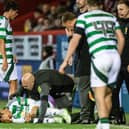Celtic's Reo hatate goes down with an injury during the 5-1 win over Aberdeen at Pittodrie. (Photo by Paul Devlin / SNS Group)