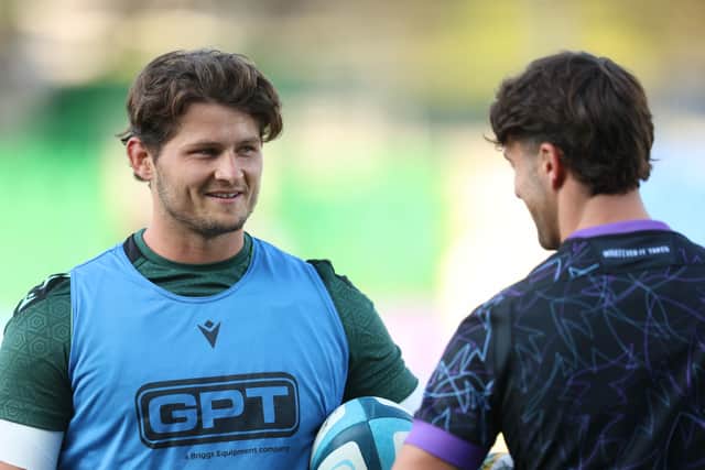 Connacht's Piers O'Conor chats with Glasgow Warriors' Adam Hastings during a pre-season match in September.