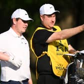 Bob MacIntyre and caddie Mike Burrow talk tactics during the first round of the 107th PGA Championship at Quail Hollow Country Club in Charlotte, North Carolina