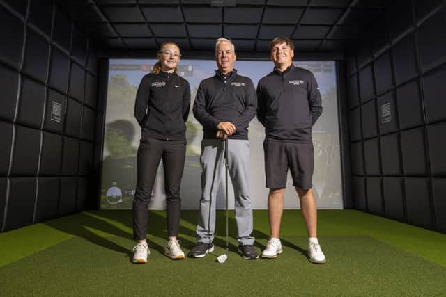Dean Robertson, the University of Stirling’s head of golf, with past programme member Louise Duncan and current scholar Ross Laird in the new state-of-the-art facilitiy