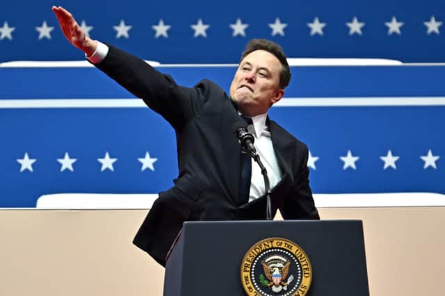 Elon Musk makes a gesture compared by some to a Nazi salute while speaking at the Capitol One Arena in Washington on the day of Donald Trump's inauguration as US President (Picture: Angeal Weiss)