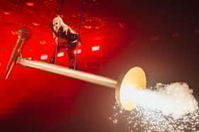 Why, yes. That is Finland's Erika Vikman flying across the Eurovision stage on a giant microphone. 