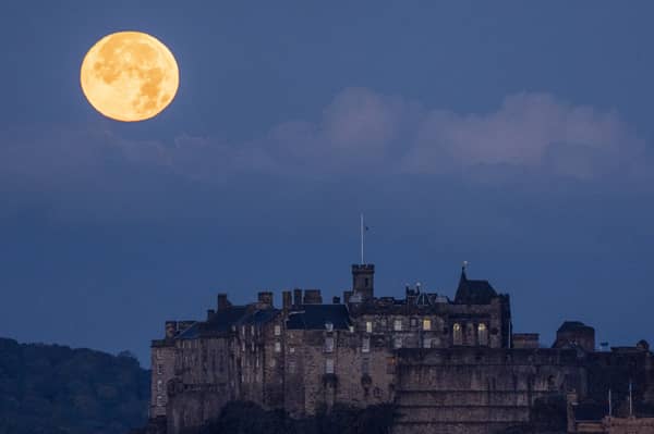 The moon sets behind Edinburgh Castle (Picture: Jane Barlow)