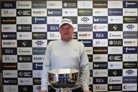 Englishman Mark Young shows off the trophy after winning the Montrose Links Masters presented by Montrose Port Authority