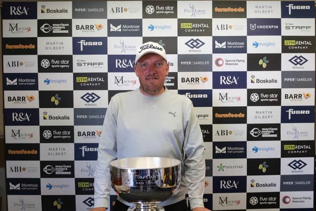 Englishman Mark Young shows off the trophy after winning the Montrose Links Masters presented by Montrose Port Authority