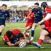 Darcy Graham stretches over the line.