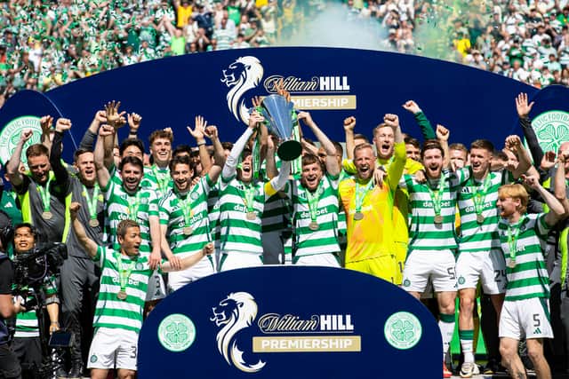 Celtic's Callum McGregor and James Forrest lift the William Hill Premiership trophy after the 1-1 draw with St Mirren. (Photo by Alan Harvey / SNS Group)