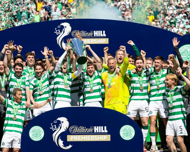 Celtic's Callum McGregor and James Forrest lift the William Hill Premiership trophy after the 1-1 draw with St Mirren. (Photo by Alan Harvey / SNS Group)