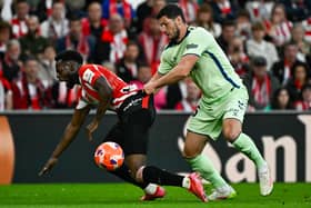 Las Palmas defender Scott McKenna tugs on Athletic Bilbao forward Inaki Williams during a La Liga match last month. (Photo by ANDER GILLENEA/AFP via Getty Images)          