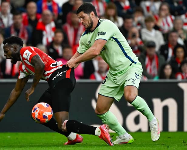 Las Palmas defender Scott McKenna tugs on Athletic Bilbao forward Inaki Williams during a La Liga match last month. (Photo by ANDER GILLENEA/AFP via Getty Images)          