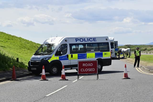 A police road block on Irvine Beach 