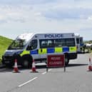 A police road block near Irvine Beach 