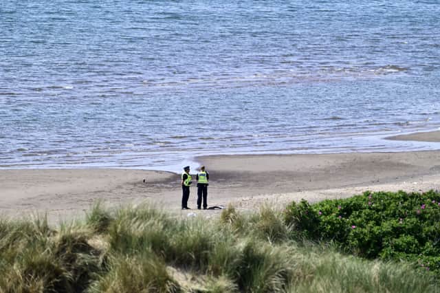 Police officers on Irvine beach on Sunday May 18